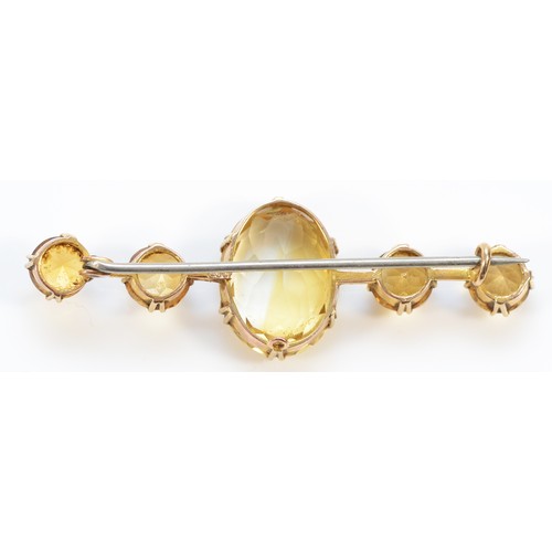 139 - A 9ct gold citrine brooch, 18mm x 14mm central gemstone, 55mm brooch, 7.2g