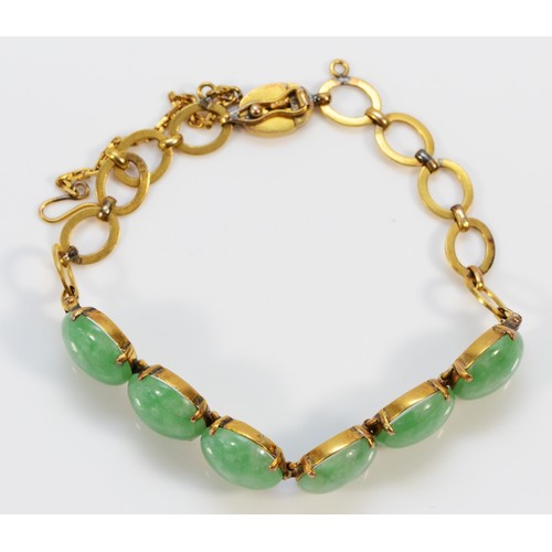 143 - A 14K gold jadeite bracelet, seven 11mm jadeite round cabochons, 17cm,