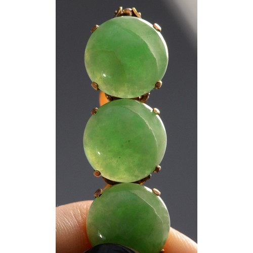 143 - A 14K gold jadeite bracelet, seven 11mm jadeite round cabochons, 17cm,