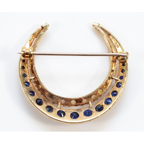 153 - A 9ct gold sapphire and seed pearl crescent brooch, 28mm diameter, London 1970, 3.4g