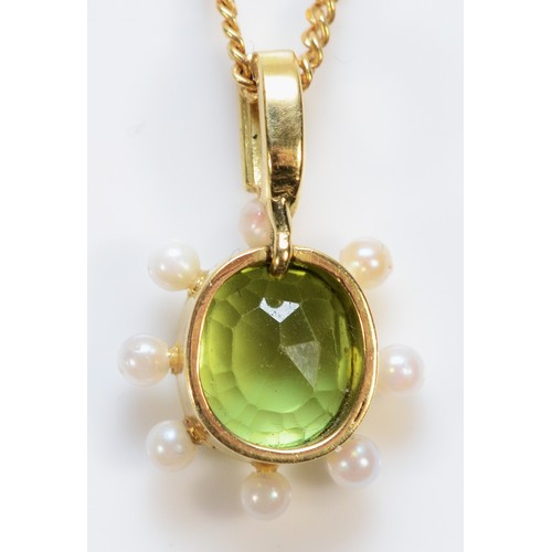 185 - An Edwardian unmarked 18ct gold peridot and seed pearl pendant, 9ct chain, 18mm drop, 4.3g