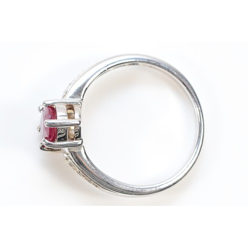 196 - A 9ct white gold ruby solitaire ring with diamond set shoulders, N, 3.4g