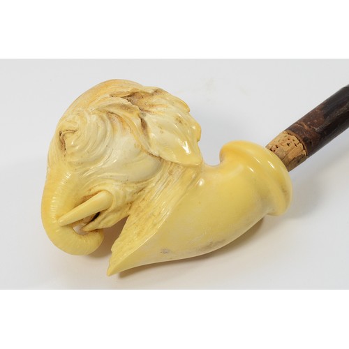 245 - An early 20th century meerschaum smoking pipe, having carved bowl in the form of an elephants head, ... 