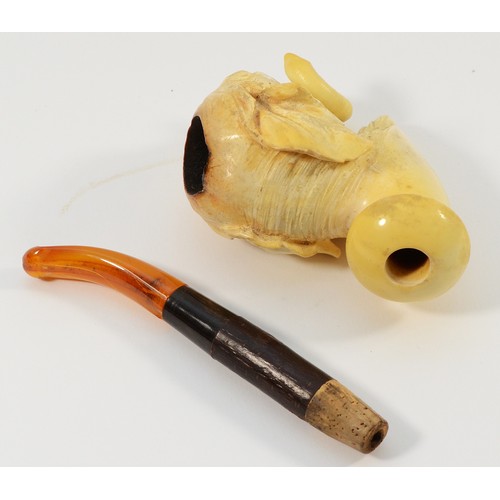 245 - An early 20th century meerschaum smoking pipe, having carved bowl in the form of an elephants head, ... 