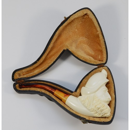 246 - An early 20th Century meerschaum smoking pipe, having carved bowl in the form of a buccaneer, in fit... 