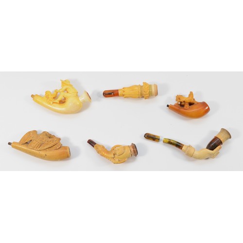 247 - Six 20th Century meerschaum smoking pipes/cigarette holders, four of which are housed in fitted case... 