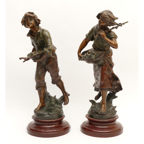 256 - After L & F Moreau (1832-1927); a pair of bronzed spelter figurines, one depicting a young boy holdi... 