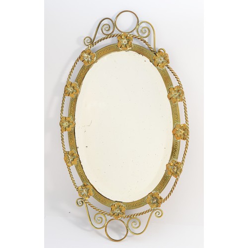 259 - A 1960's brass-framed wall mirror with bevelled edges and decorated with pansies, 51cm.