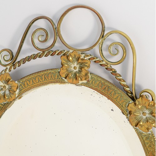 259 - A 1960's brass-framed wall mirror with bevelled edges and decorated with pansies, 51cm.