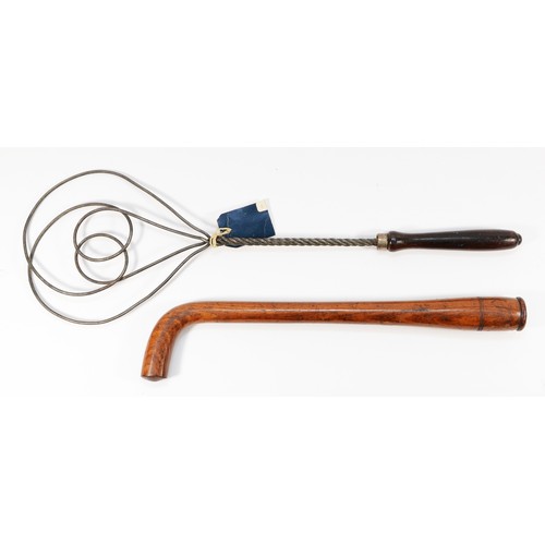 260 - A Victorian hardwood tipstaff, with a curved handle and a pokerwork embellishment, in the form of th... 