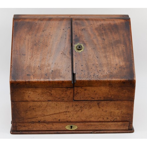 265 - A late Victorian walnut stationary box, the sloping hinged top revealing pigeon holes, two inkwells,... 