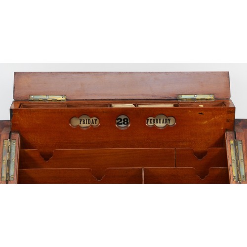 265 - A late Victorian walnut stationary box, the sloping hinged top revealing pigeon holes, two inkwells,... 