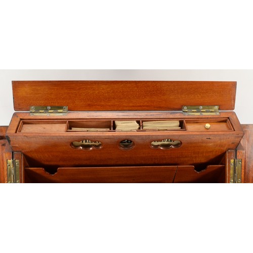 265 - A late Victorian walnut stationary box, the sloping hinged top revealing pigeon holes, two inkwells,... 