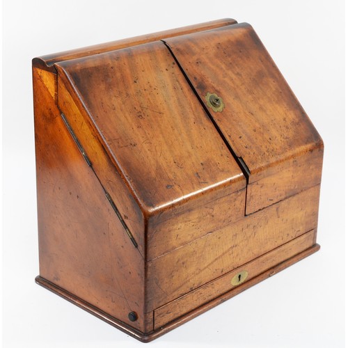 265 - A late Victorian walnut stationary box, the sloping hinged top revealing pigeon holes, two inkwells,... 