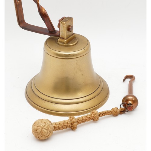 268 - A 20th Century brass ships bell with braided rope and hanging bracket, H-20cm. 

Provenance: Acquire... 