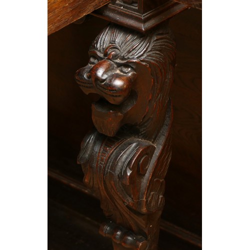 379 - A Victorian profusely carved oak hall-stand, the moulded cornice with foliate carved decoration over... 