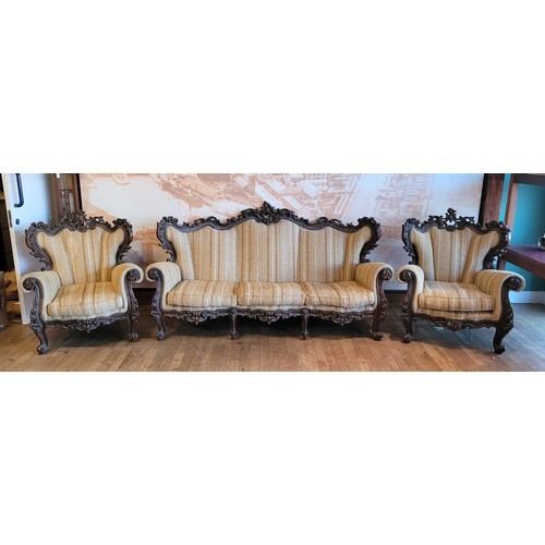 381 - A 20th century Italian Baroque three piece suite, comprising three seat sofa and two armchairs, hard... 