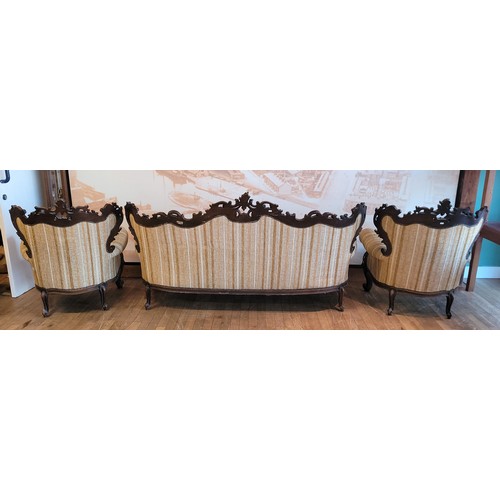 381 - A 20th century Italian Baroque three piece suite, comprising three seat sofa and two armchairs, hard... 