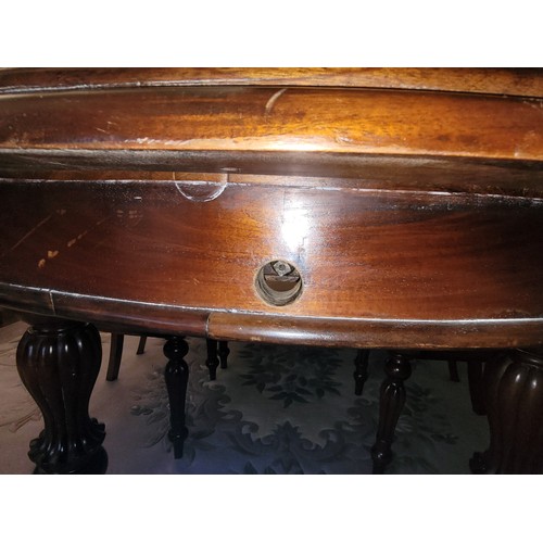 382 - A 20th Century mahogany dining suite, comprising wind-out dining table, having moulded edge circular... 