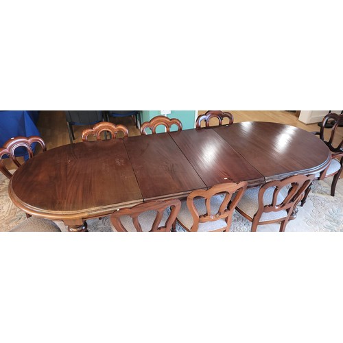 382 - A 20th Century mahogany dining suite, comprising wind-out dining table, having moulded edge circular... 