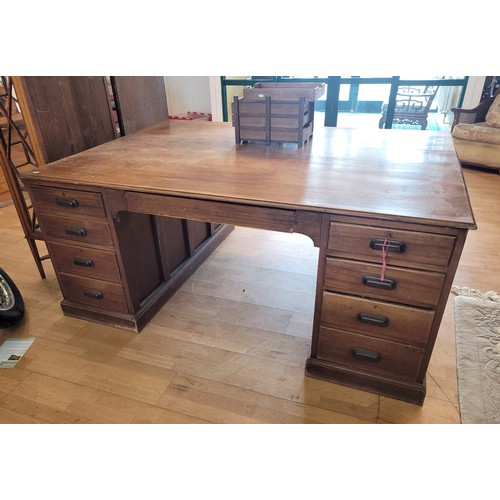 383 - A mahogany twin pedestal partners desk, circa early 20th century, the rectangular top with moulded e... 