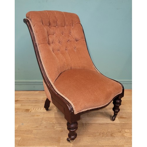 374 - A Victorian spoon back armchair, having scroll arm terminals the button back upholstered in pale pin... 