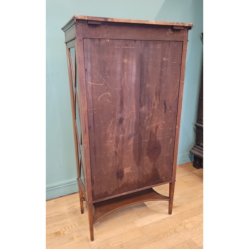 377 - An Edwardian inlaid mahogany and satinwood display cabinet, having single glazed door opening to fit... 