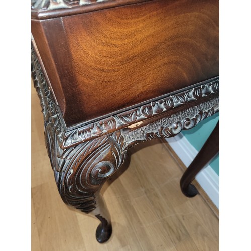 380 - A Queen Anne style mahogany display cabinet, having two bevel edge glazed doors enclosing two glass ... 