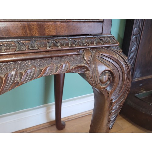 380 - A Queen Anne style mahogany display cabinet, having two bevel edge glazed doors enclosing two glass ... 