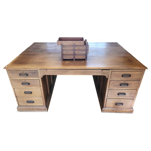 383 - A mahogany twin pedestal partners desk, circa early 20th century, the rectangular top with moulded e... 