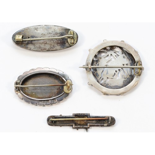 25 - Four Victorian silver and silver gilt brooches, 21g