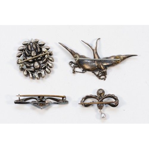 35 - Four silver and paste brooches, two of which are unmarked, one is 900 silver and the last is 925 sil... 