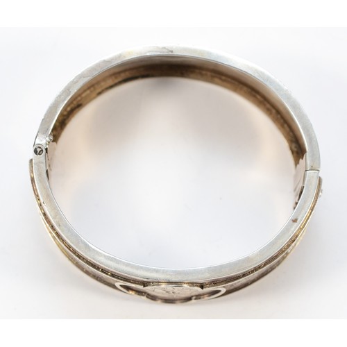 41 - A Victorian sterling silver Aesthetic movement hinged bangle, 55mm, 31g