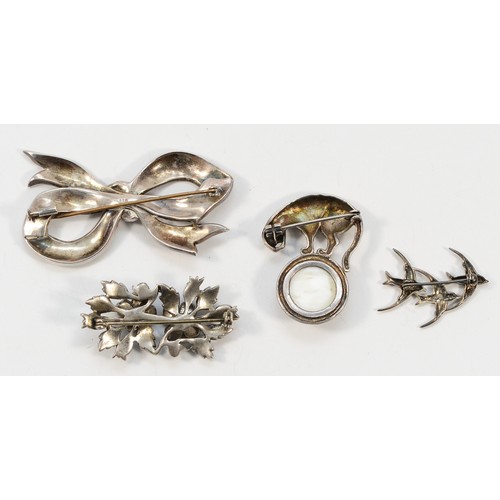 47 - Two 925 silver and marcasite brooches, largest 60mm, a silver and marcasite floral brooch, 45mm, and... 