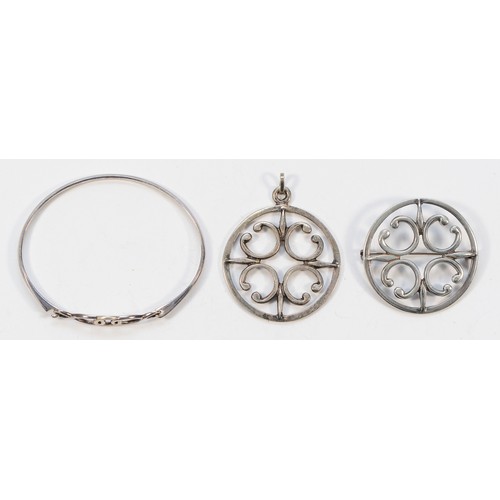 54 - Ola Gorie, a 925 silver circular pendant, 40mm, with a matching brooch, 40mm, and a 925 silver bangl... 