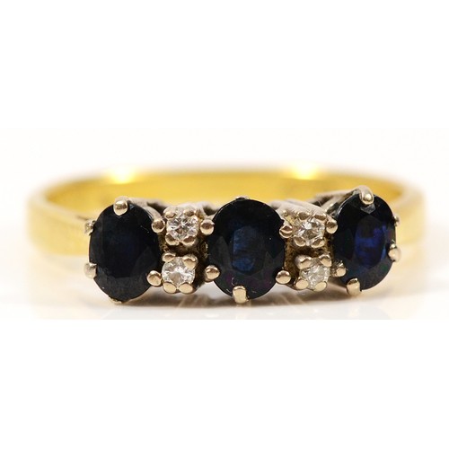 65 - An 18ct gold sapphire and diamond seven stone ring, Birmingham 1979, M 1/2, 3g