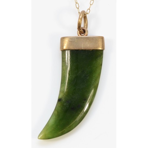 67 - A 9ct gold nephrite claw pendant with a chain, 30mm drop, 3.6g