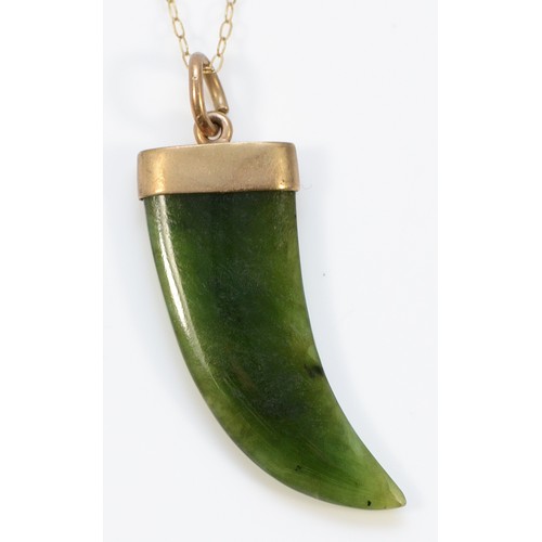 67 - A 9ct gold nephrite claw pendant with a chain, 30mm drop, 3.6g