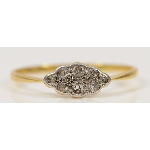 744 - An 18ct gold and platinum diamond cluster ring, R 1/2, 1.5g