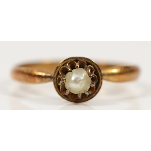 750 - An unmarked 15ct seed pearl dress ring, hallmarks removed possibly due to resizing, O, 2g