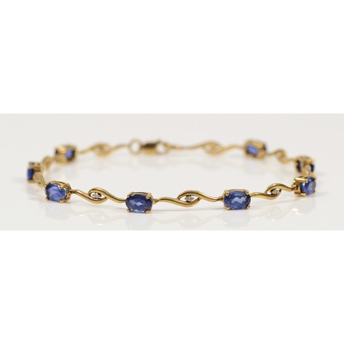 753 - A 9ct gold diamond and sapphire bracelet, 19cm, 4.9g