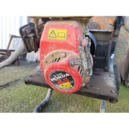 5 - A petrol driven cement mixer, Honda 2.5 G100 engine, recently used and now the job has been finished... 