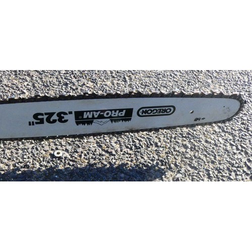 24 - An EAC FPC-SP52 2.4kw petrol chainsaw to include a green 5L plastic jerry can.