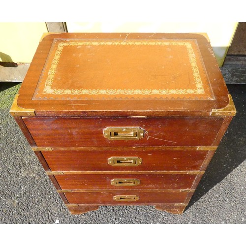 42 - A four drawer mahogany veneered storage unit with bracket feet, a brown and gold embossed leather in... 