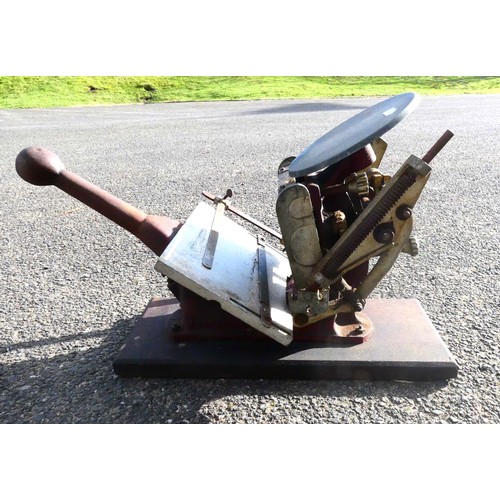 42 - A four drawer mahogany veneered storage unit with bracket feet, a brown and gold embossed leather in... 