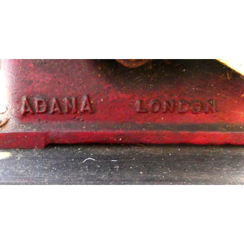 42 - A four drawer mahogany veneered storage unit with bracket feet, a brown and gold embossed leather in... 