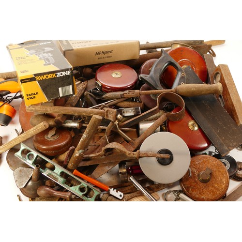 52 - Collection of early to mid twentieth century tools to include brass spray cans, tape measures, spiri... 