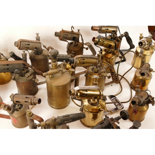 58 - A collection of early to mid twentieth century brass blow lamps to include, Primus, Bladon and Optim... 