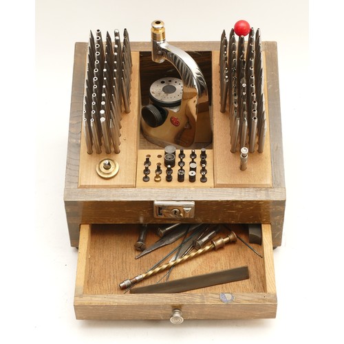 A Japanese Meikosha staking tool kit, in wooden case with curved cover, nearly complete and in good order.