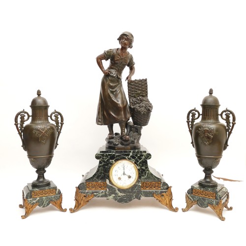 A mid-nineteenth century French three piece variegated marble garniture, comprising of a mantel clock, surmounted by a female figure with a large basket of fruit, entitled 'Endangeuse' by  L & F Moreau (1832-1927), with a painted enamel dial featuring Arabic Numerals and stamped 'E Bernard. Mayenne', and a Fritz Marti eight day movement, stamped '473', striking on bell, H-68cm, together with two lidded urns, H-45cm.

Makers: The 'L' stands for Louis Auguste (1855-1919), known for bronzes. The 'F' stands for Hippolyte Francois (1832-1927), a painter and sculptor.

Condition: It is not ticking at the time of cataloguing. There is a significant crack to the glass protecting the dial.